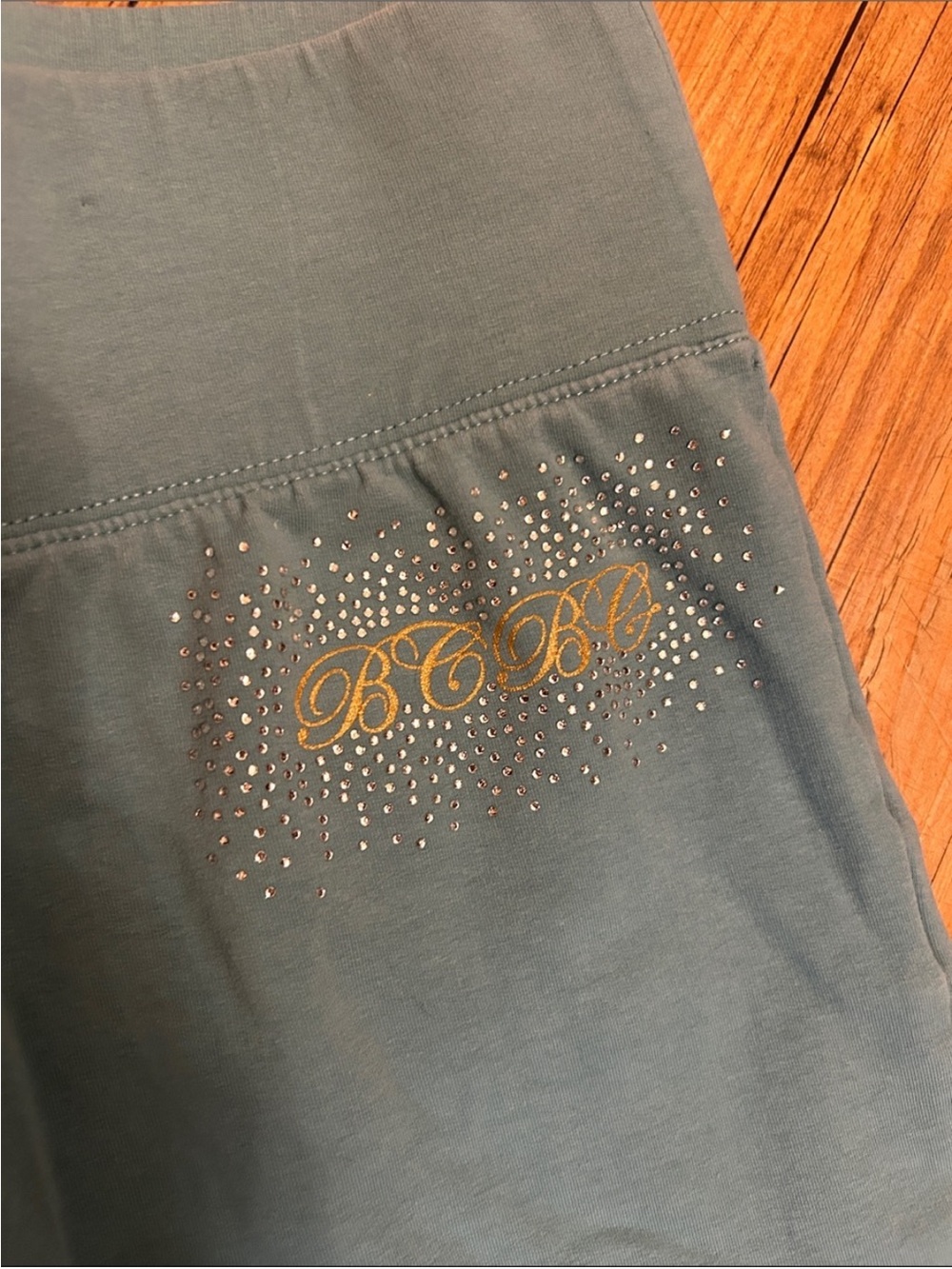 BCBGMaxAzria Teal Flared Leggings with Gold Floral Detail - Picture 3 of 6